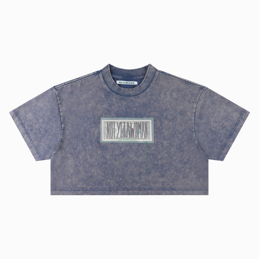 “NOT YET A WOMAN” DOLLAR CROP TEE WASHED BLUE