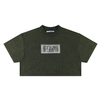 “NOT YET A WOMAN” DOLLAR CROP TEE WASHED GREEN